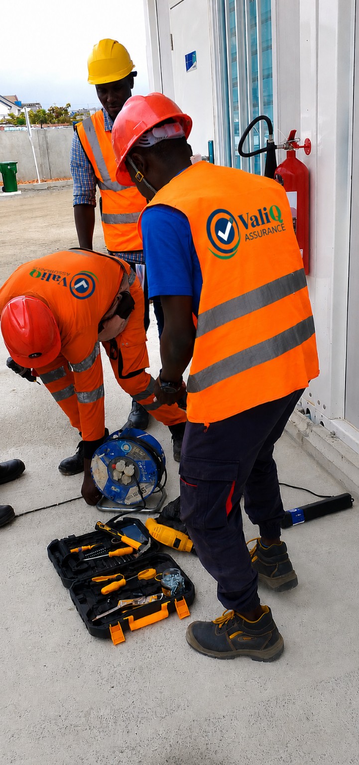 ValiQ Assurance staff installing fire extinguishers